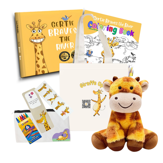 A curated gift set featuring a yellow 'Gertie Braves the River' coloring book, a white tote bag with matching giraffe graphics, a pack of colorful crayons, and a plush yellow-and-brown giraffe toy, all arranged on a white background.